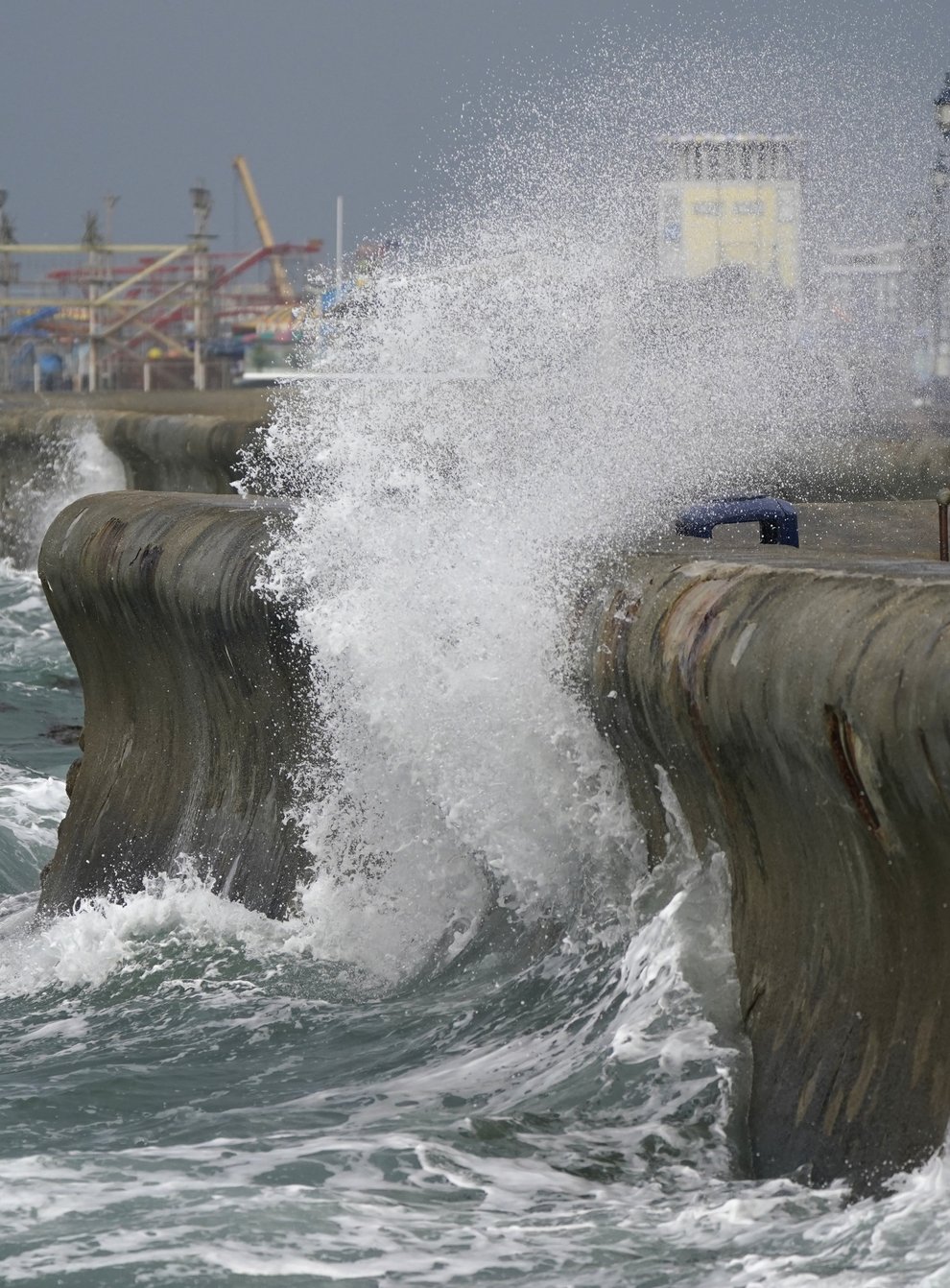 Waves crash against the sea walls in Southsea, Hampshire (PA)