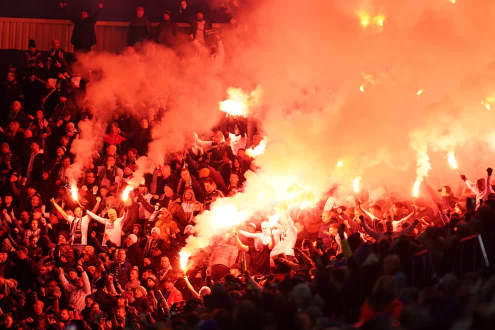 Legia Warsaw fans in the stands set off flares during the Europa League match (Mike Egerton/PA)
