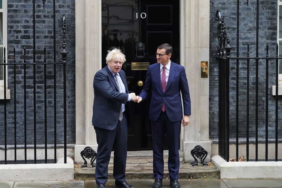 Boris Johnson greets Mateusz Morawiecki outside 10 Downing Street (Stefan Rousseau/PA)