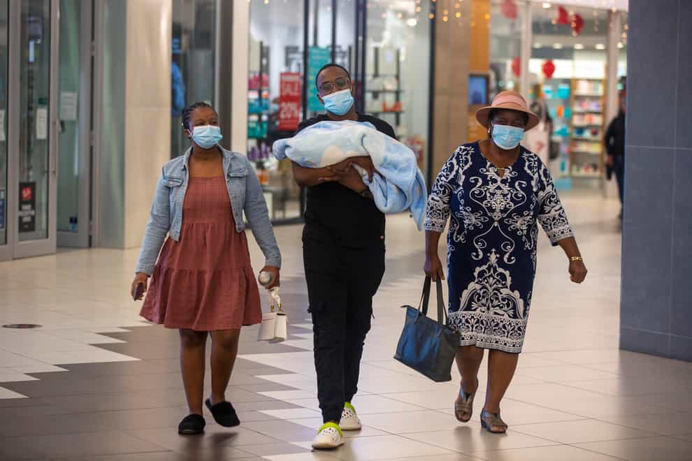 People wearing masks at a shopping centre in Johannesburg, South Africa (Denis Farrell/AP)