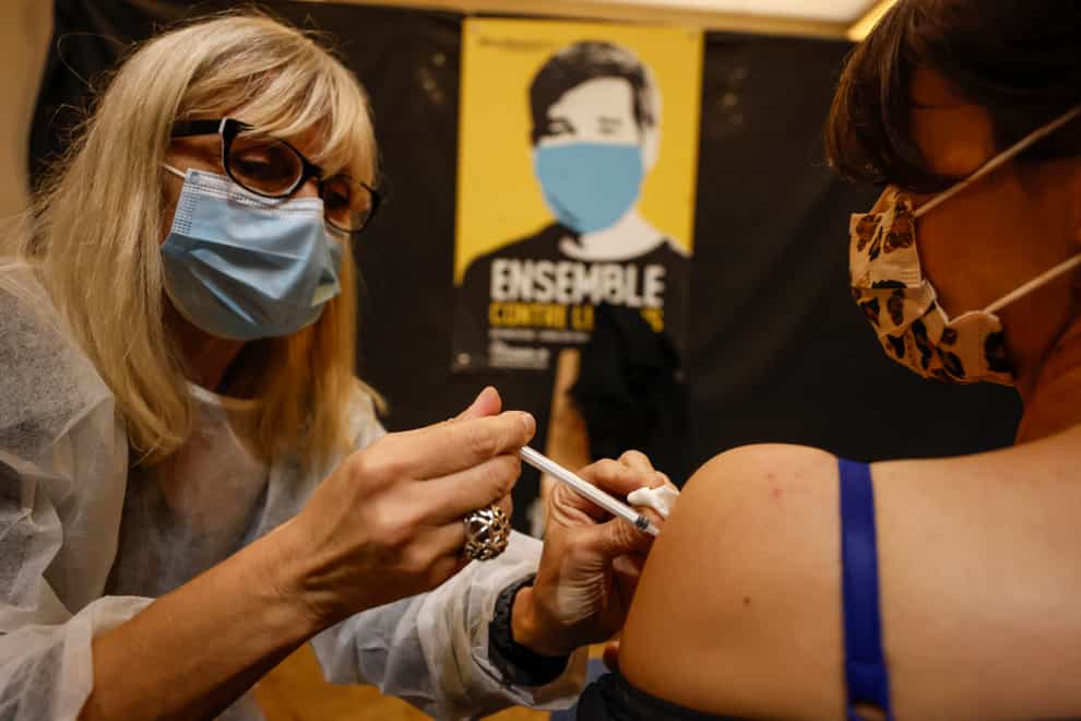 A woman receives a Pfizer Covid-19 vaccine in Strasbourg, eastern France (Jean-Francois Badias)