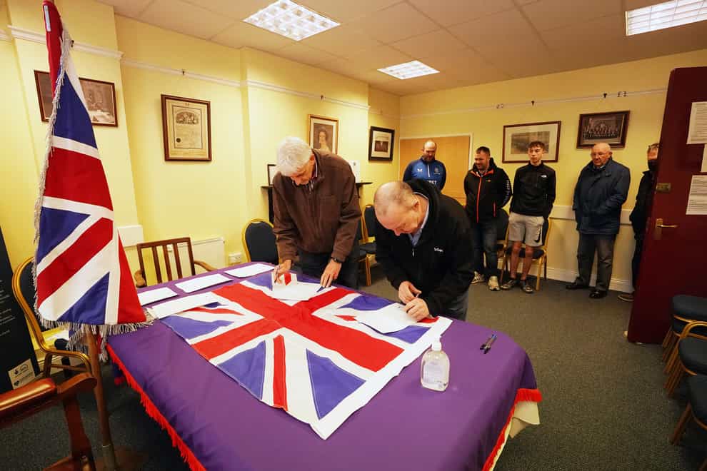 People queue up at Carlton Street Orange Hall in Portadown to sign a declaration in opposition to the Northern Ireland Protocol (Niall Carson/PA)