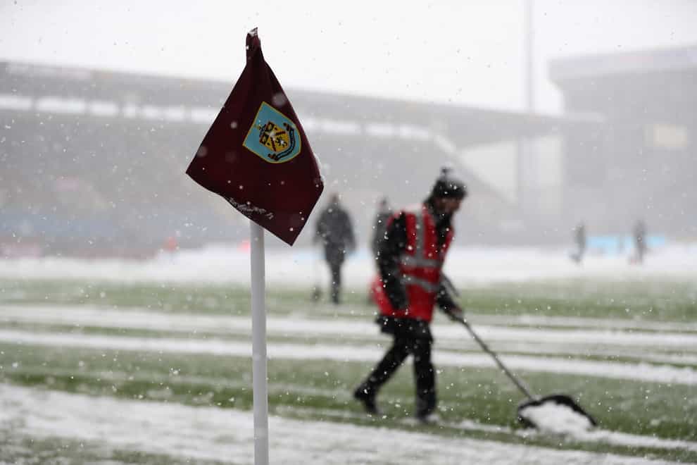 Burnley’s home Premier League game was postponed despite attempts to clear the snow at Turf Moor (Bradley Collyer/PA)