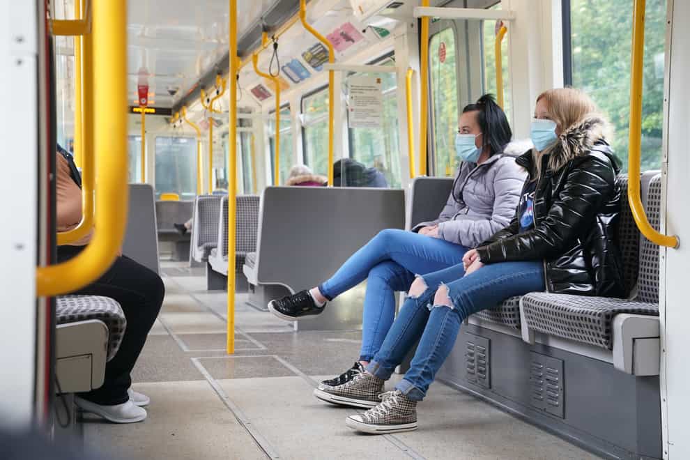 Passengers wearing face masks on a train in Newcastle as face coverings once again become mandatory on public transport in England (Owen Humphreys/PA)