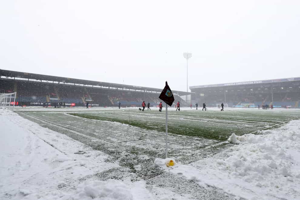 Despite the best efforts of ground staff at Turf Moor, Burnley’s game with Tottenham was called off (Bradley Collyer/PA)