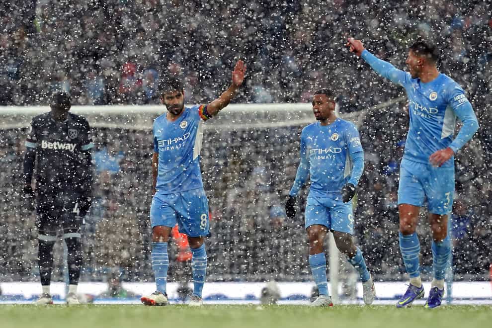 Manchester City weathered the snow to claim a hard-fought win over West Ham (Martin Rickett/PA)