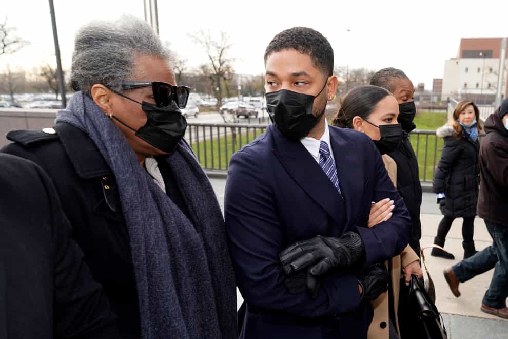 Actor Jussie Smollett looks back at his mother as they arrive with other family members at a Chicago court (Charles Rex Arbogast/AP)