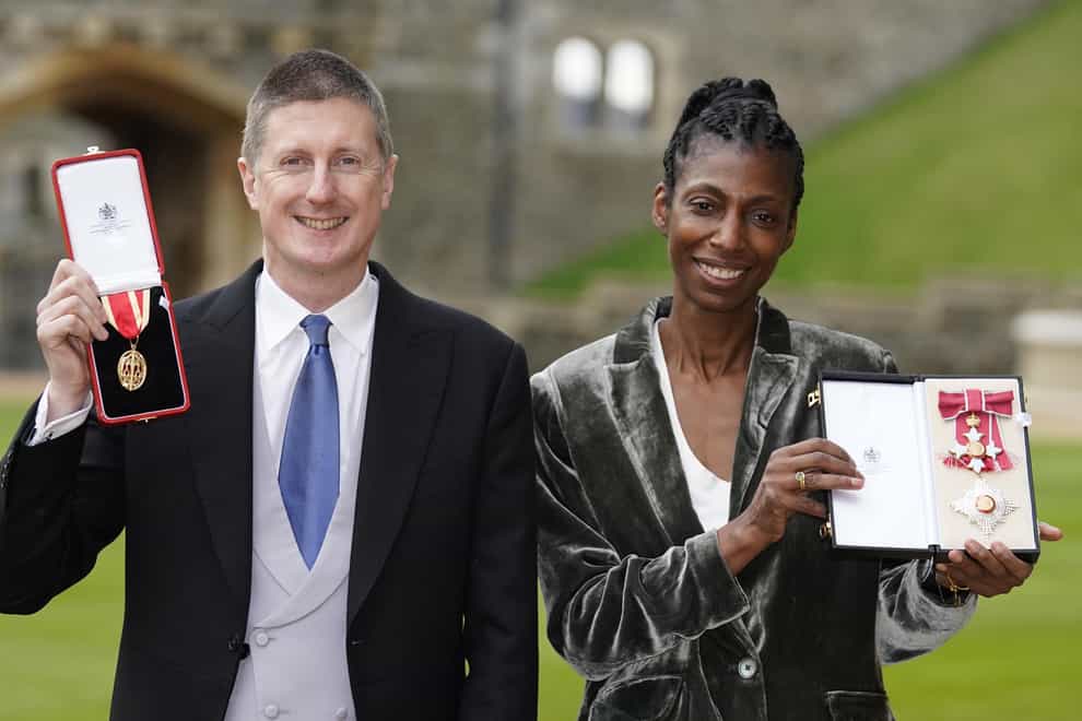 Dame Sharon White and her husband Sir Robert Chote with the awards they received at an investiture ceremony at Windsor Castle (Andrew Matthews/PA)