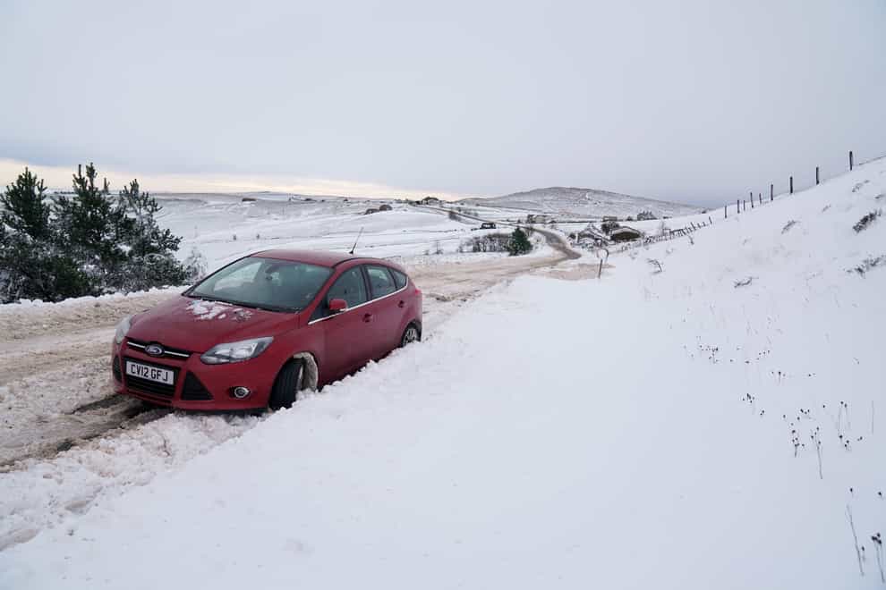 An abandoned vehicle on the A53 close to Buxton in Derbyshire, amid freezing conditions in the aftermath of Storm Arwen (PA)
