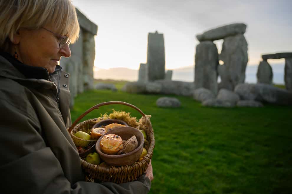 English Heritage volunteers are baking Neolithic inspired mince pies at Stonehenge (English Heritage/PA)
