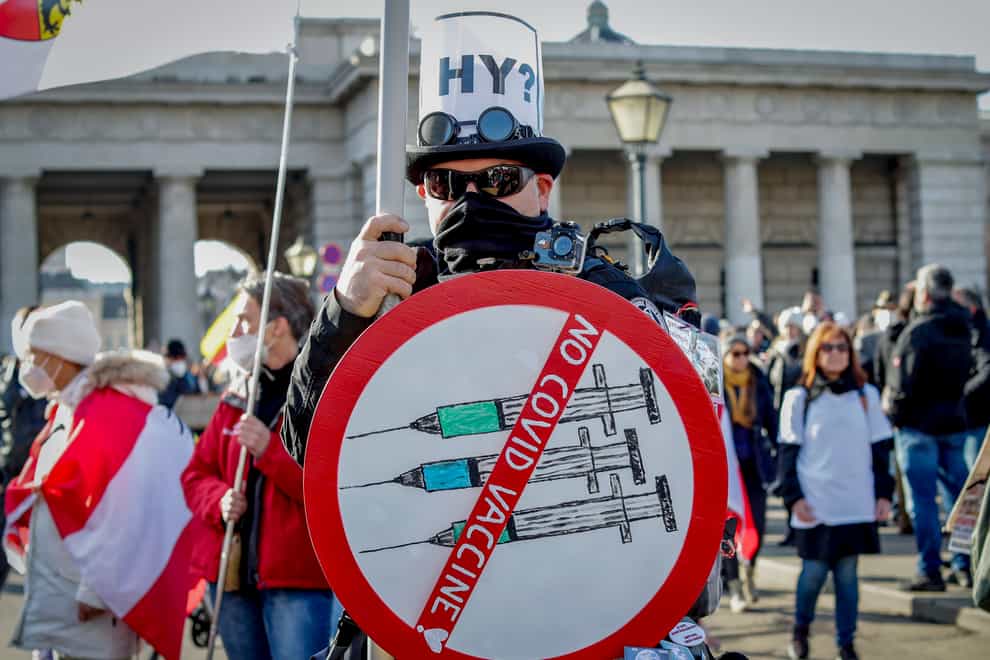 A man takes part in a demonstration against coronavirus restrictions in Vienna in Austria (Lisa Leutner/AP)