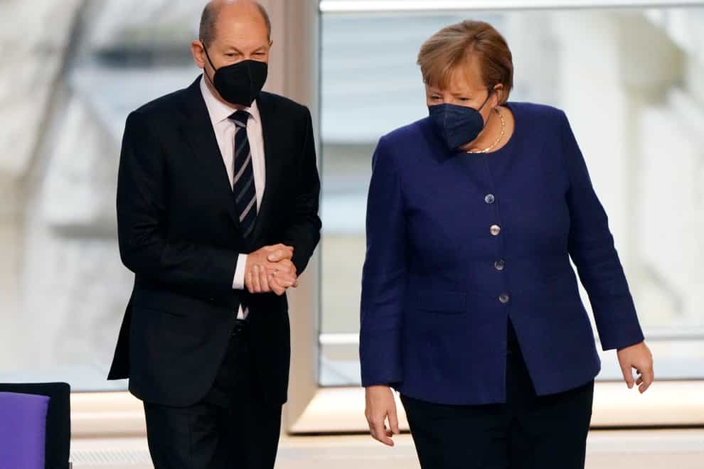 German chancellor Angela Merkel, right, and finance minister Olaf Scholz (Markus Schreiber/AP)