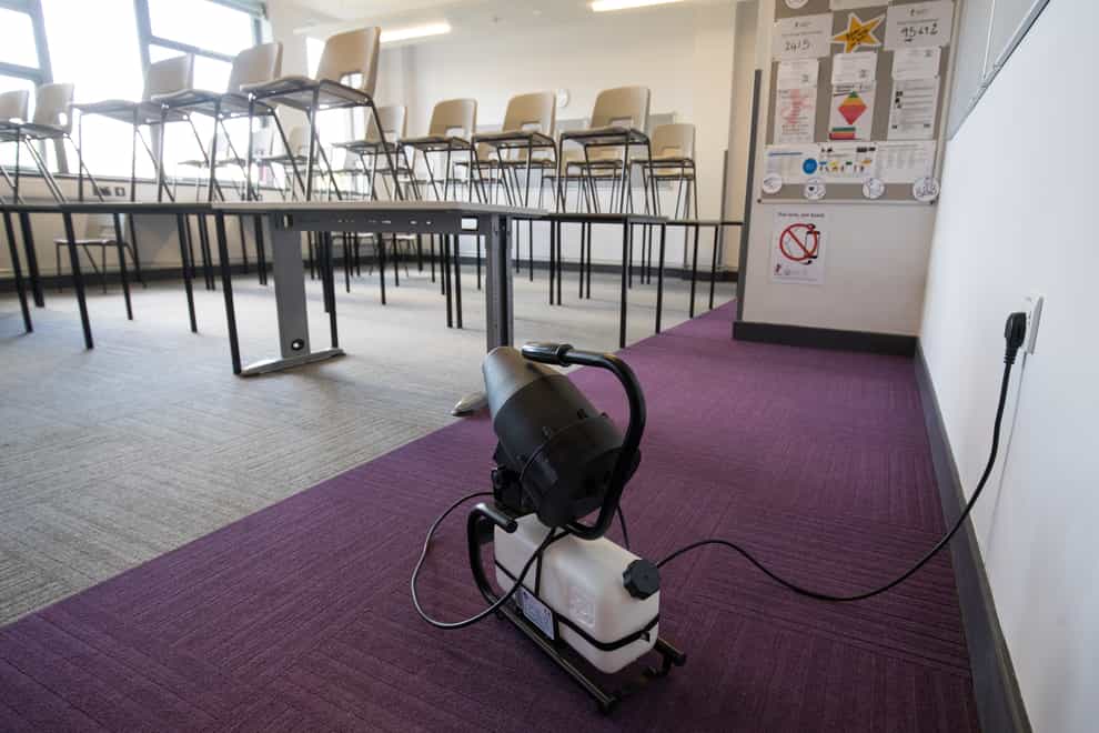 A fogging machine, which can disinfect a whole classroom, is set up in a classroom (Andrew Matthews/PA)