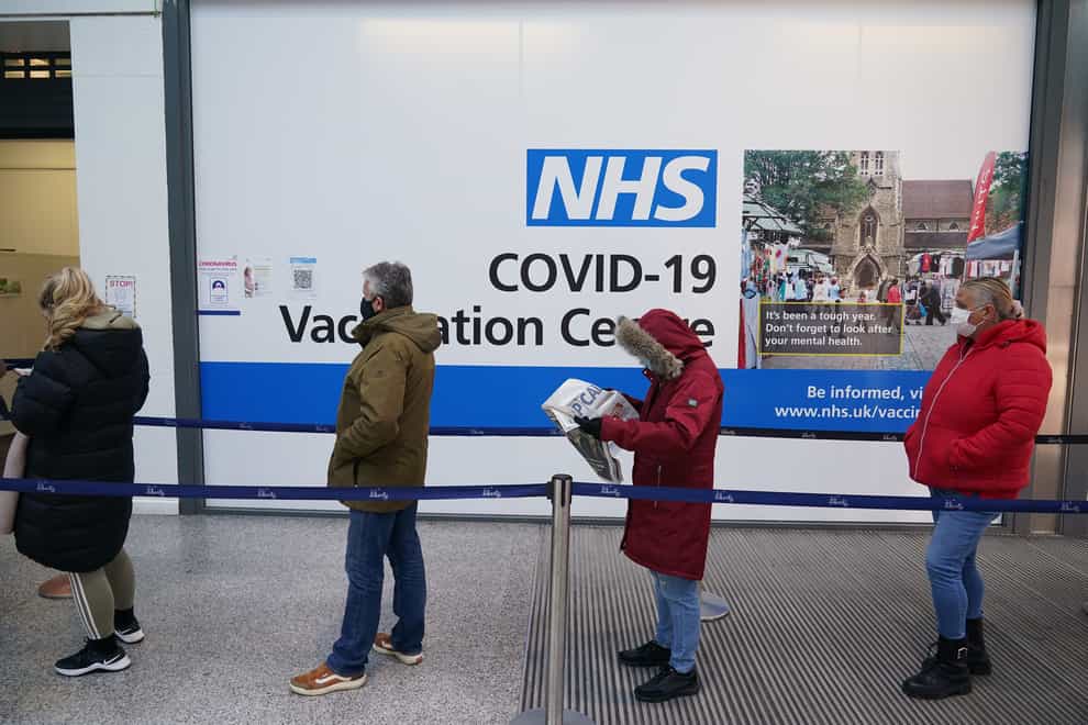 People queuing to receive their Covid-19 vaccinations at a site in Liberty shopping centre, Romford, east London (Yui Mok/PA)
