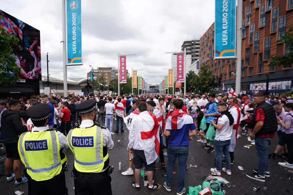 Police watch England fans outside Wembley ahead of the Euro 2020 final (Zac Goodwin/ PA)