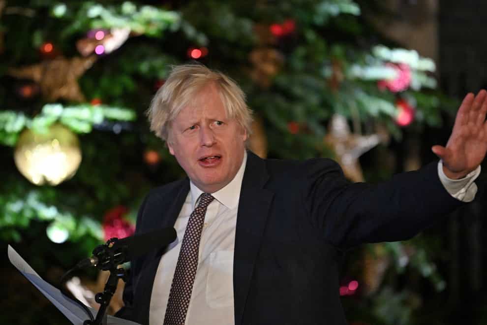 Boris Johnson by the Christmas tree outside 10 Downing Street (Justin Tallis/PA)