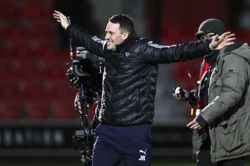 Chesterfield manager James Rowe celebrates in front of the fans (Bradley Collyer/PA)