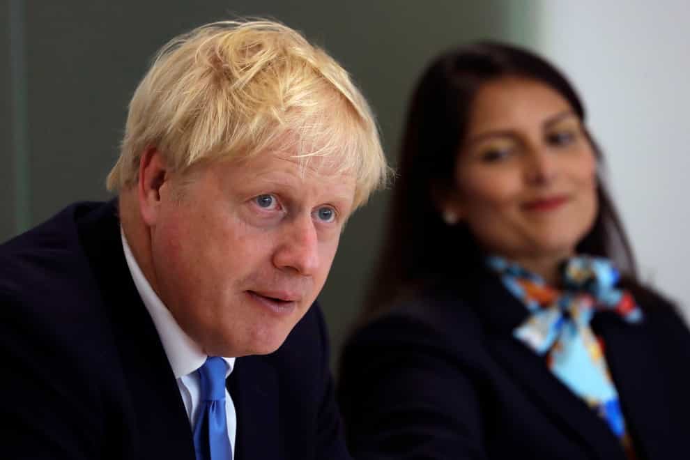 Prime Minister Boris Johnson with Home Secretary Priti Patel (PA)