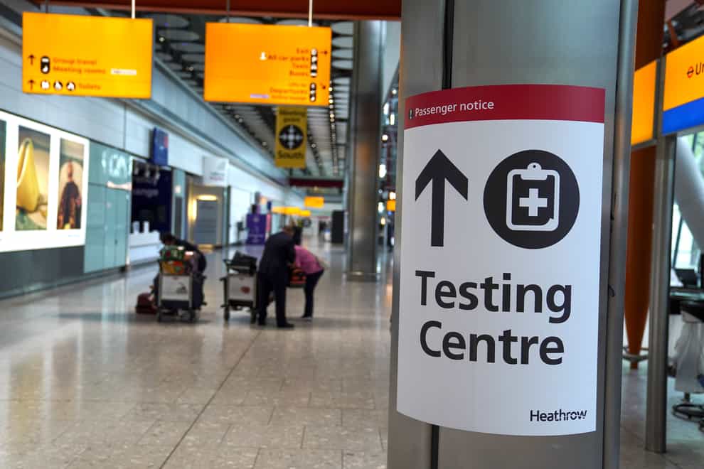 A sign directs passengers to a testing centre at Heathrow Airport (PA)