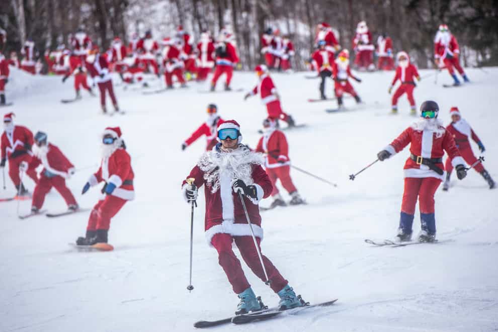 Santas hit the slopes in Maine (Andree Kehn/Sun Journal via AP)