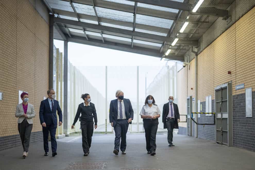 Prime Minister Boris Johnson (centre) alongside Deputy Prime Minister Dominic Raab (second left) during a visit to HMP ISIS in Greenwich in London to mark the publication of the Prisons Strategy White Paper. Picture date: Tuesday December 7, 2021. (Geoff Pugh/The Daily Telegraph/PA)