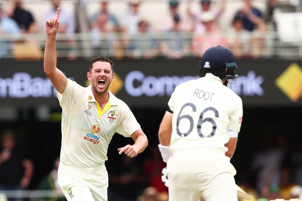Australia’s Josh Hazlewood celebrates the wicket of England’s Joe Root during day one of the first Ashes test at The Gabba, Brisbane (Jason O’Brien/PA)