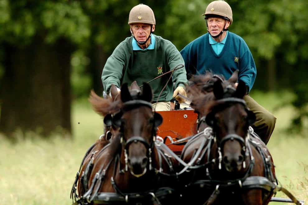 he Duke of Edinburgh (left) competes at the Sandringham Country show Horse Driving Trials (Chris Radburn/PA)