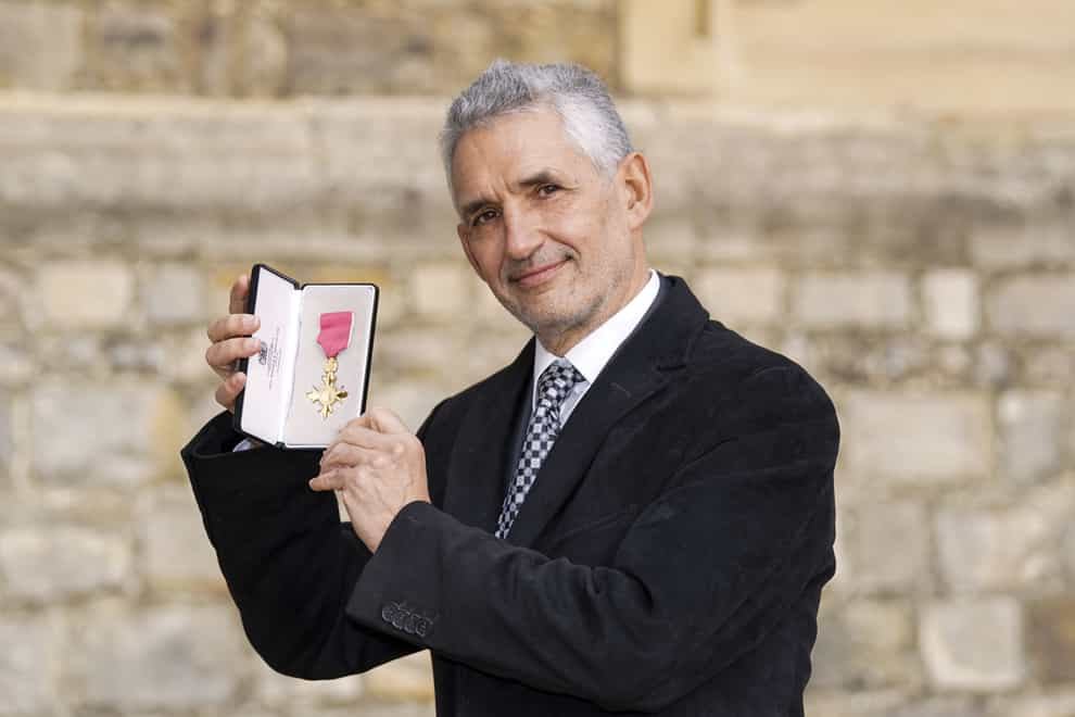 Professor Timothy Spector – Professor of Genetic Epidemiology at King’s College, London – with his award after he was made a OBE (Steve Parsons/PA)