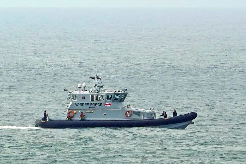A Border Force vessel intercepts a group of people (Gareth Fuller/PA)