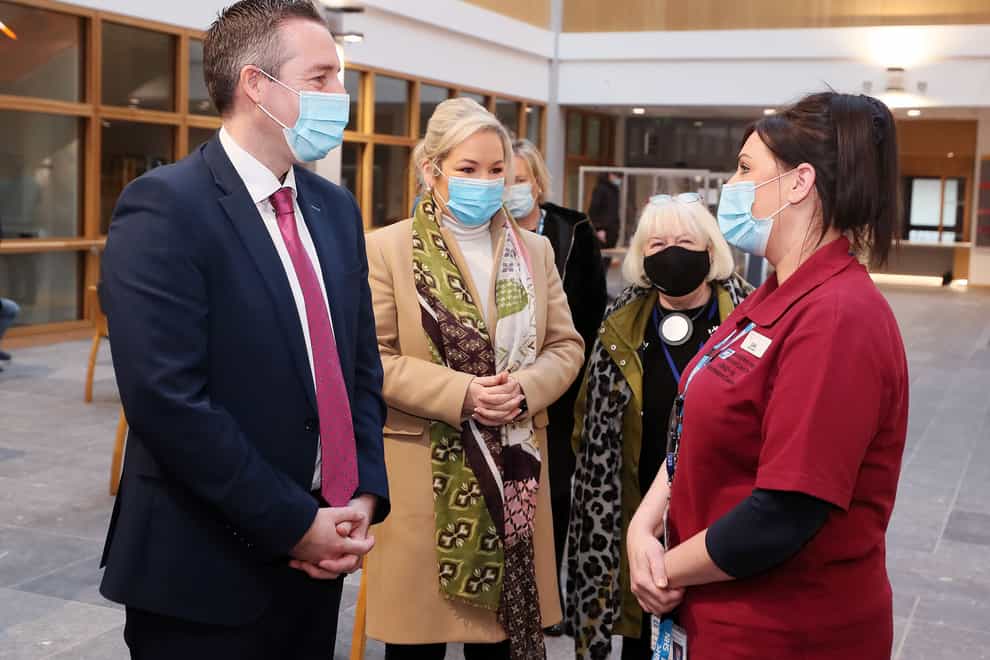 First Minister Paul Givan, Deputy First Minister Michelle O’Neill and head of the vaccination programme Patricia Donnelly (right) at Lisburn Primary and Community Care Centre (Jonathan Porter/Press Eye/PA)