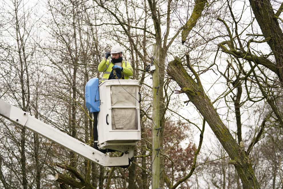 An Openreach engineer fixes telephone lines near Barnard Castle in County Durham in the aftermath of Storm Arwen (Danny Lawson/PA)