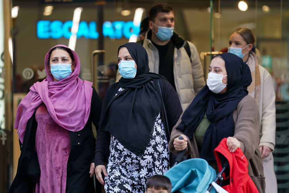 Shoppers leave a Primark in Birmingham, as mask wearing in stores and on public transport becomes mandatory. (Jacob King/PA)