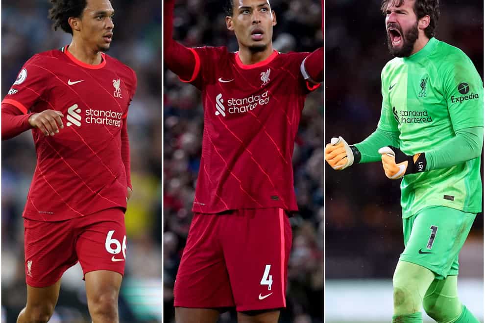 Trent Alexander-Arnold, Virgil van Dijk and Alisson Becker, l-r, are riding high with Liverpool (Mike Egerton/Peter Byrne/Nick Potts/PA)