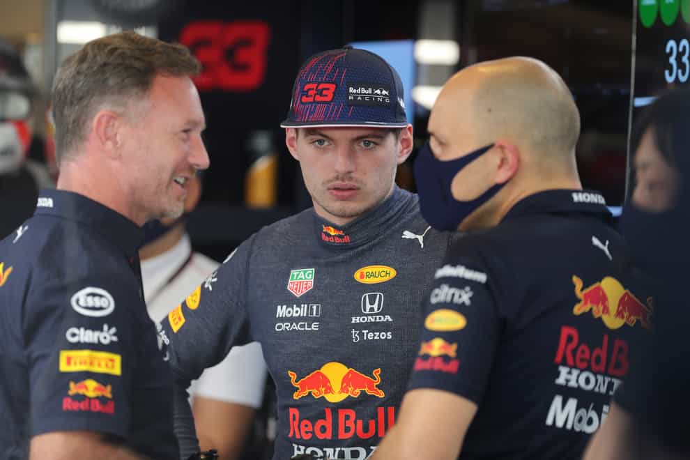 Max Verstappen, centre, goes into the season-ending Abu Dhabi Grand Prix on Sunday locked level on points with reigning champion Lewis Hamilton (Kamran Jebreili/AP)
