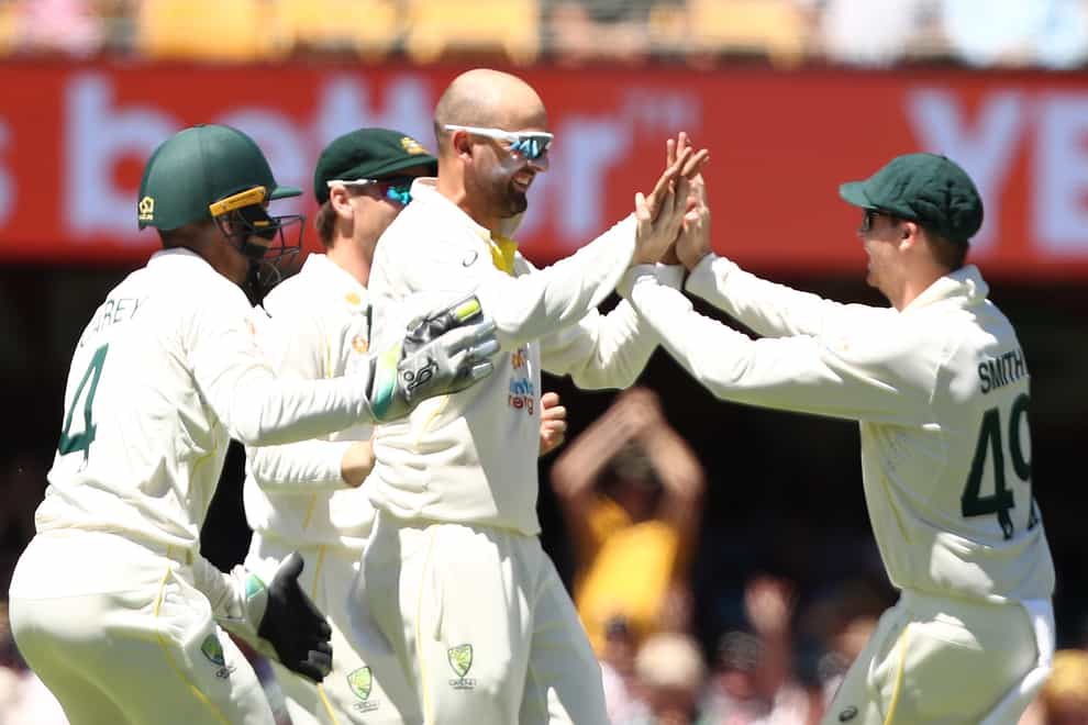 Australia’s Nathan Lyon celebrates the wicket of England’s Ollie Pope during day four of the first Ashes test at The Gabba, Brisbane (Jason O’Brien/PA)