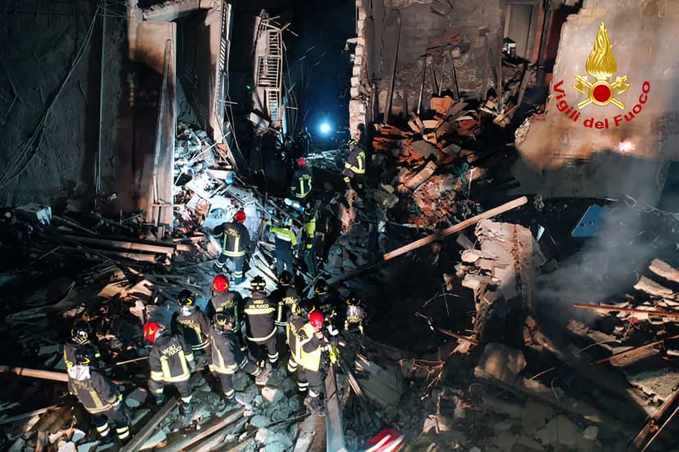 Italian firefighters and rescuers search for survivors among the rubble of a collapsed building in Ravanusa, Sicily (Italian Firefighters Vigili del Fuoco/AP)