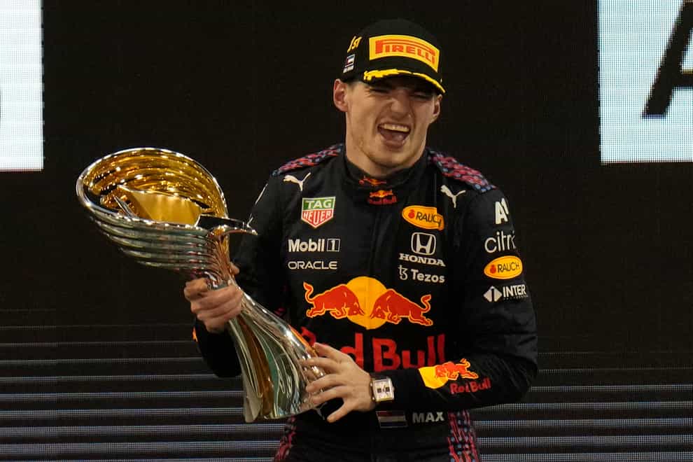 Max Verstappen celebrates on the podium (Hassan Ammar/AP)