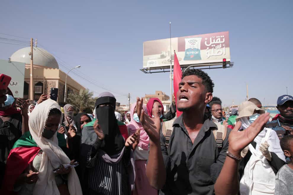 People protest in Khartoum in Sudan (Marwan Ali/AP)