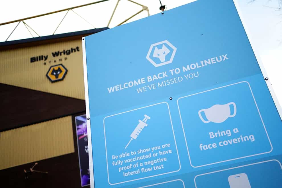 A view of coronavirus safety advice outside the ground before the Premier League match at Molineux Stadium, Wolverhampton. Picture date: Saturday November 20, 2021.