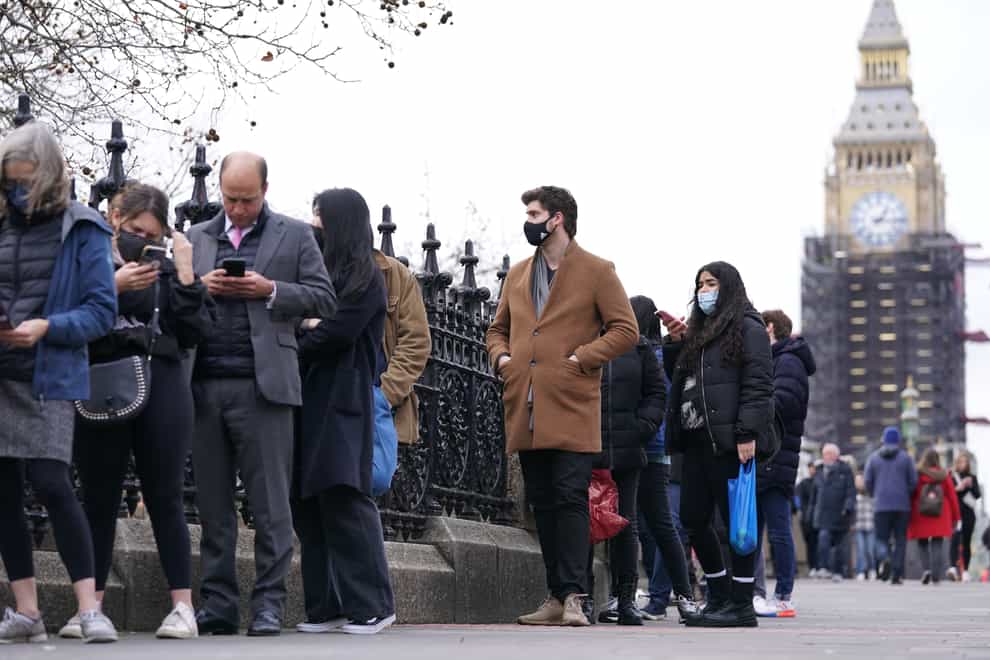 People queuing on Westminster Bridge for booster jabs (Kirsty O’Connor/PA)