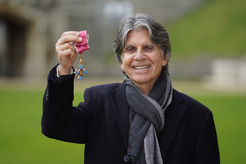 Children’s author and illustrator Anthony Browne shows off his award (Andrew Matthews/PA)