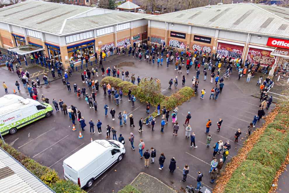 Hundreds of people queue at a vaccination centre in Bristol (Ben Birchall/PA)