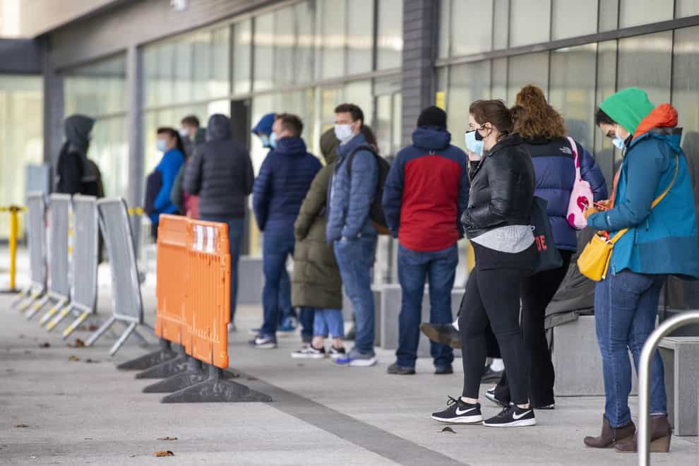 People queuing at the Covid-19 vaccination centre at Dundonald Hospital in Belfast, Northern Ireland (Liam McBurney/PA)