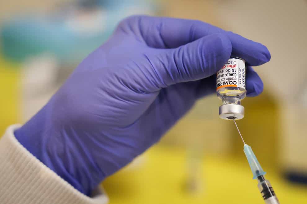 A German medical worker prepares to deliver a vaccine (Christian Charisius/dpa via AP)