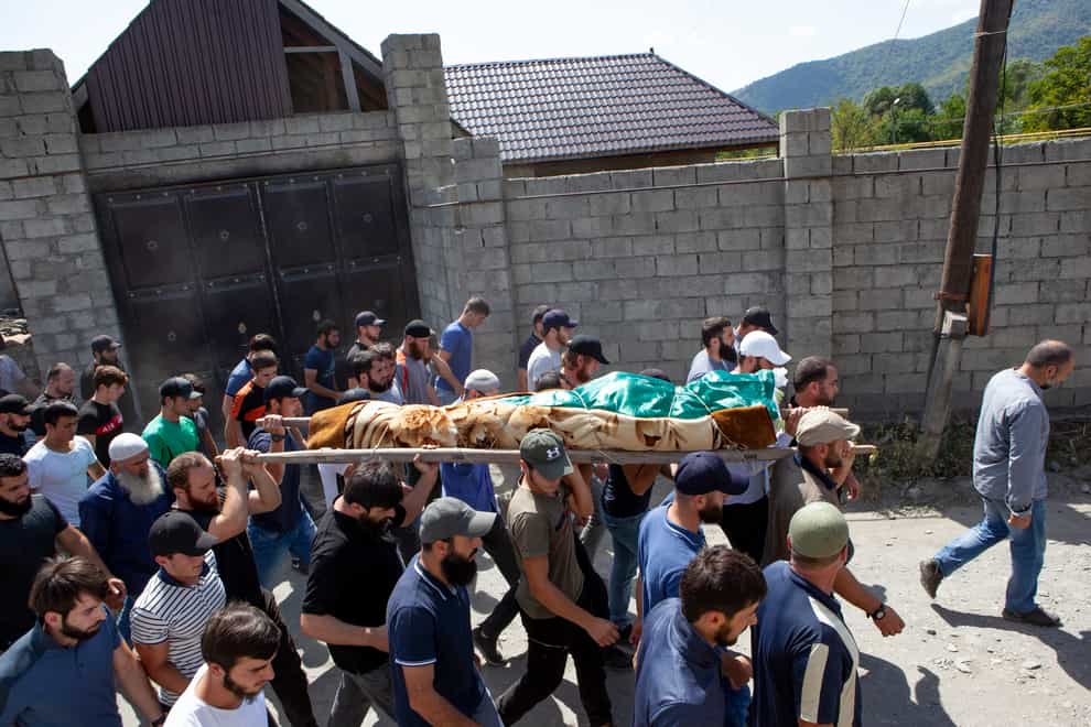 Crowds turned out for the funeral of Zelimkhan Khangoshvili when his body was returned to Georgia (AP Photo/Zurab Tsertsvadze)
