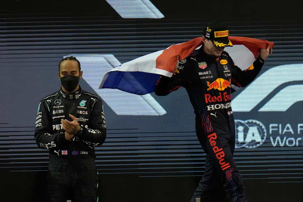 Max Verstappen and Lewis Hamilton displayed contrasting emotions on the Abu Dhabi podium (Hassan Ammar/AP)