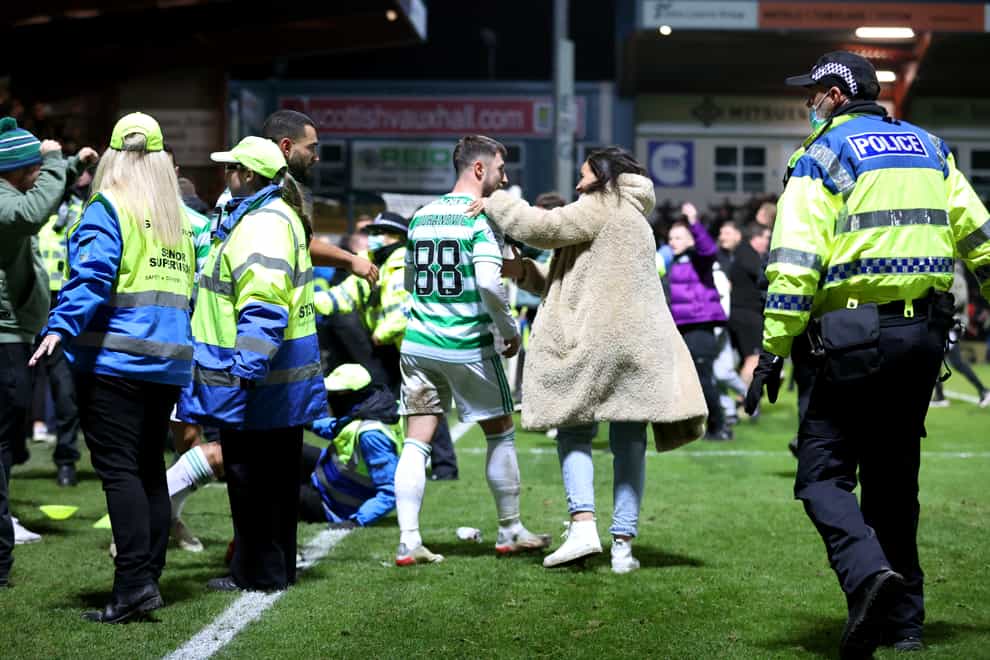 Supporters ended up on the pitch after the winner (Steve Welsh/PA)