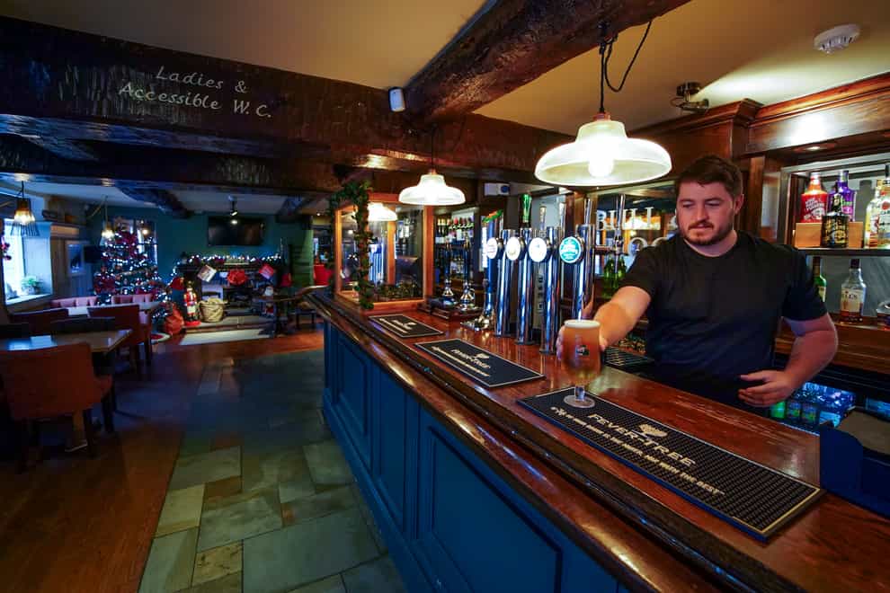 Keith McGimpsey, landlord at the Bull and Dog pub and restaurant in Ormskirk, prepares to open after more bookings were cancelled. Hospitality firms are ramping up calls for support from the Government for hard-hit pubs and restaurants as the Omicron variant sweeps the country and consumer confidence is knocked by new restrictions and increasing health warnings. Picture date: Thursday December 16, 2021.