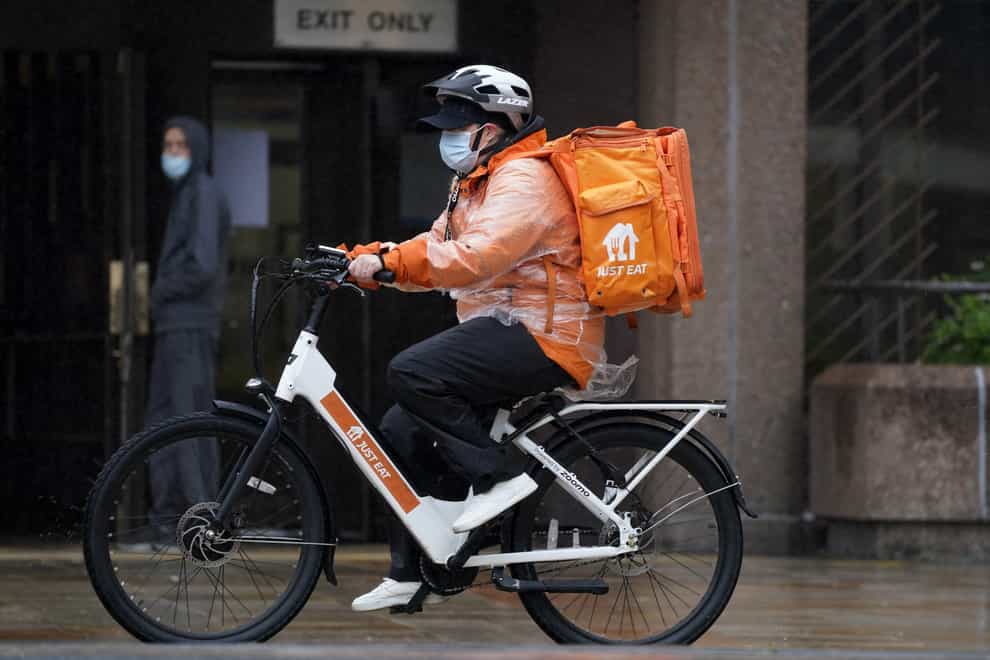 Just Eat has expanded into rapid grocery deliveries through a new partnership with Asda (Peter Byrne/PA)