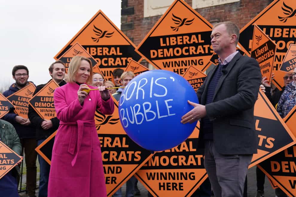 Newly elected Liberal Democrat MP Helen Morgan, bursts a ‘Boris’ bubble’ held by colleague Tim Farron (Jacob King/PA)